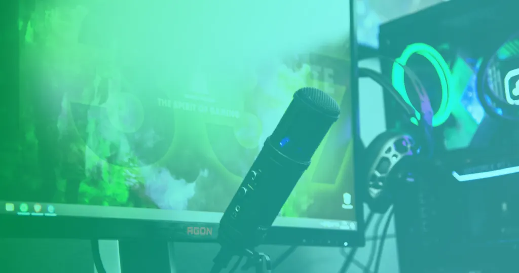 Streaming setup with microphone and lit gaming PC, representing Twitch streaming tools